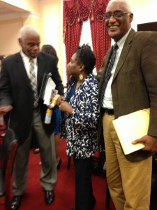 Former House Judiciary counsel Ron LeGrande converses with Nkechi Taifa; Mel Wilson (National Association of Social Workers), smiles        